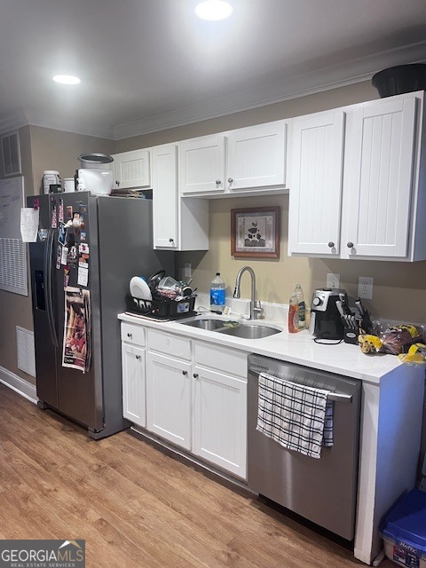 1035 South Barnett Shoals Road, Unit 913 Athens, GA 30605 - Photo 8 of 14 a kitchen with stainless steel appliances granite countertop a refrigerator sink and cabinets