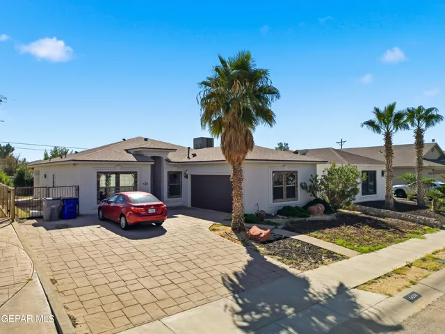 a view of house with outdoor seating and kitchen view