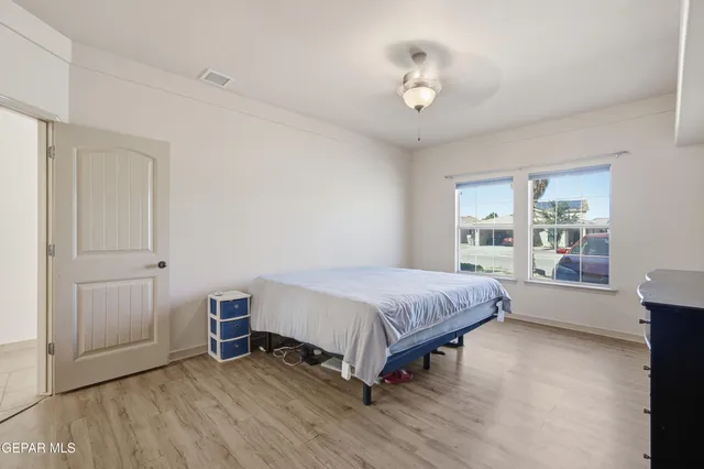 a bathroom with a double vanity sink and mirror