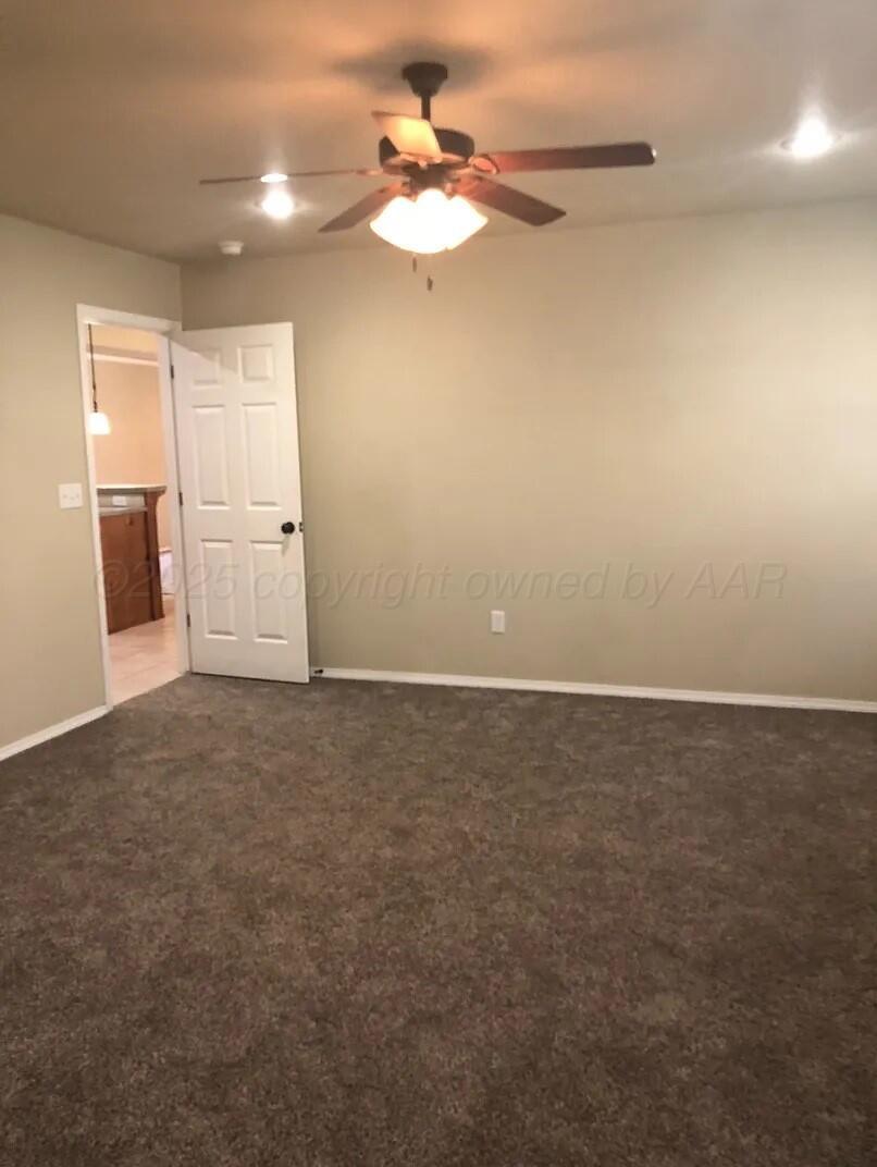 6809 Nick Street Amarillo, TX 79119 - Photo 9 of 13 a view of a livingroom with an empty space