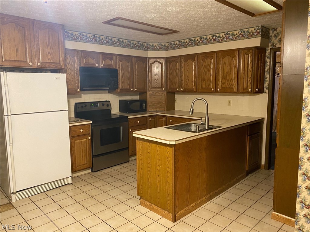 244 Spell Road Kent, OH 44240 - Photo 3 of 28 Appliances may or may not work, include range, fridge, dishwasher, microwave.