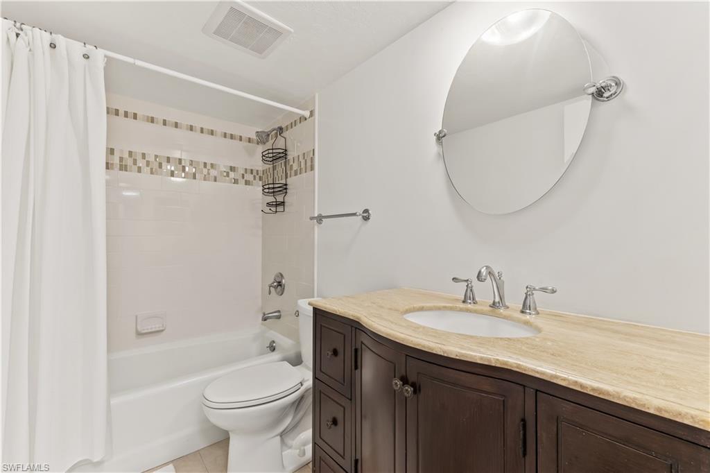 1020 Palm View Drive, Unit C302 Naples, FL 34110 - Photo 12 of 19 Full bath with vanity, shower / bathtub combination with curtain, and light tile patterned floors