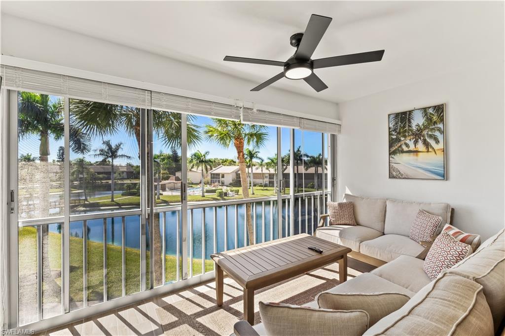 1020 Palm View Drive, Unit C302 Naples, FL 34110 - Photo 17 of 19 Sunroom featuring a water view
