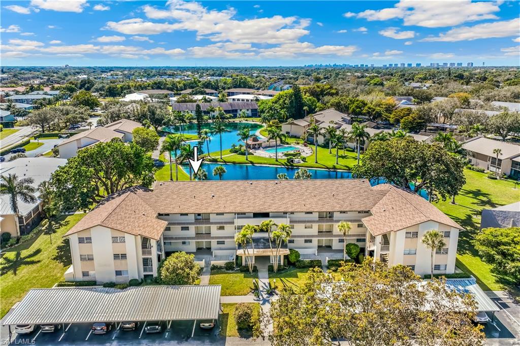 1020 Palm View Drive, Unit C302 Naples, FL 34110 - Photo 18 of 19 Bird's eye view of apartment complex and a large body of water