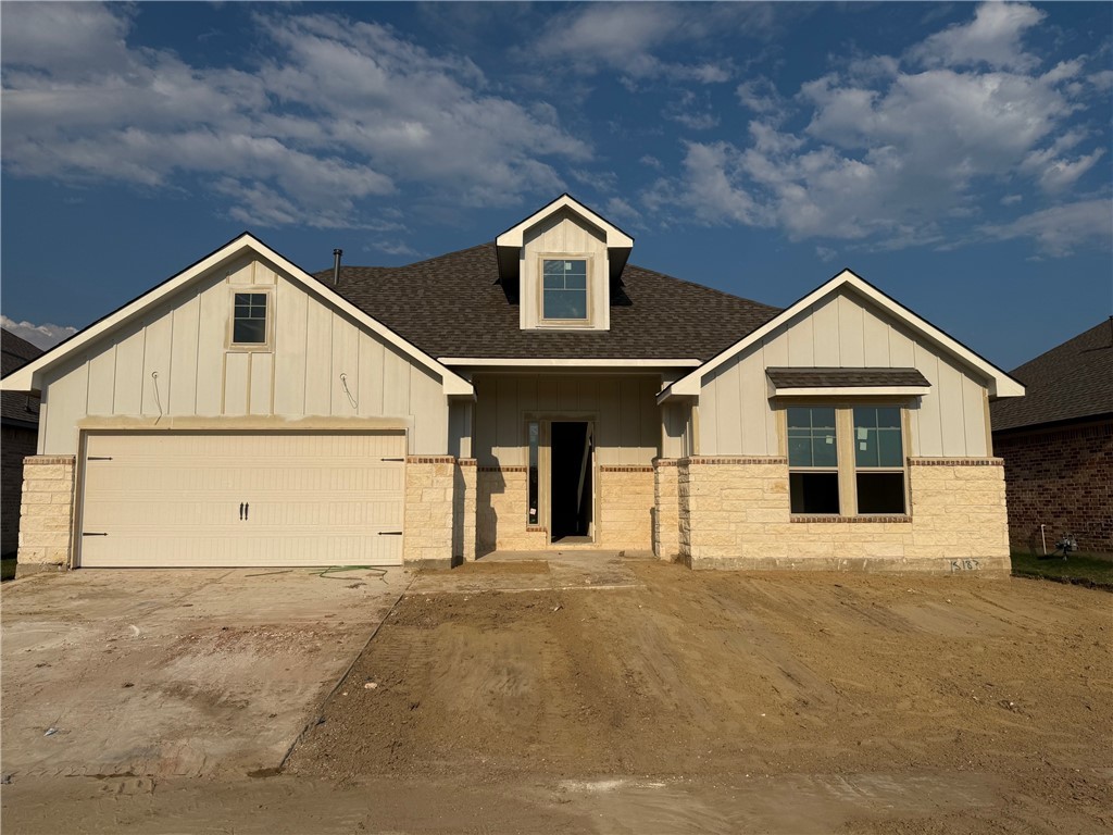 View of front facade with roof with shingles, board and batten siding, driveway, a garage, and a porch