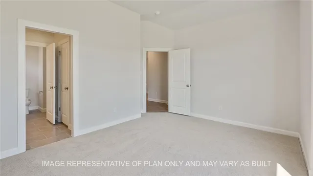 a bathroom with a tub a sink and mirror