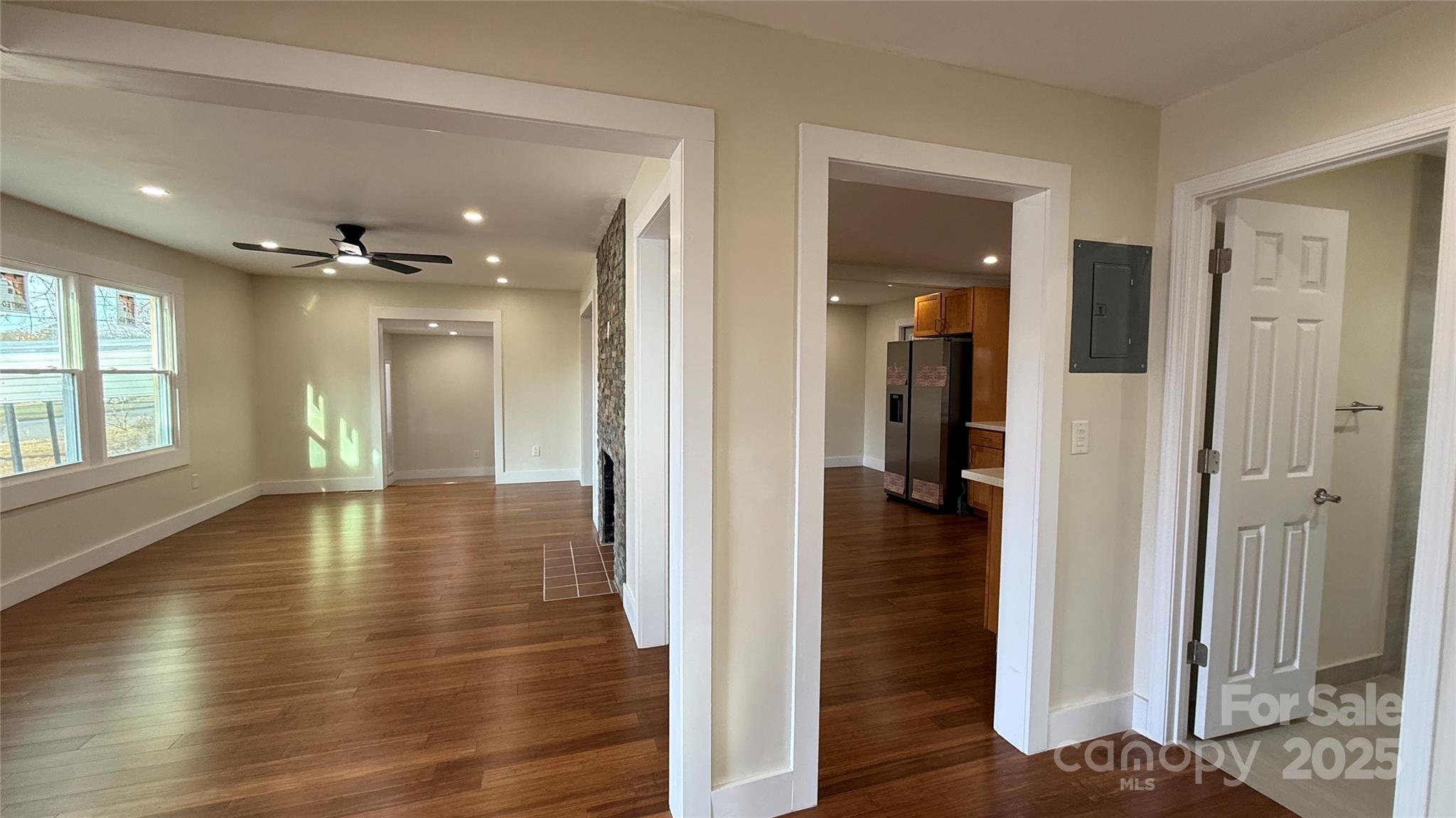 809 Howard Street Shelby, NC 28152 - Photo 25 of 41 a view of a hallway with wooden floor and a bathroom