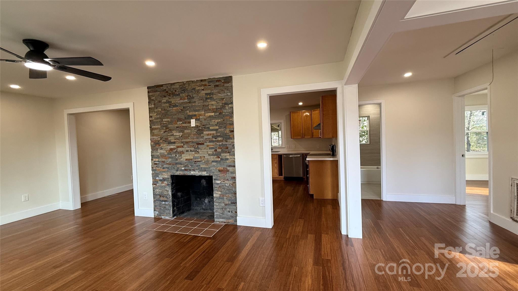 809 Howard Street Shelby, NC 28152 - Photo 26 of 41 a view of a hallway with wooden floor and a fireplace