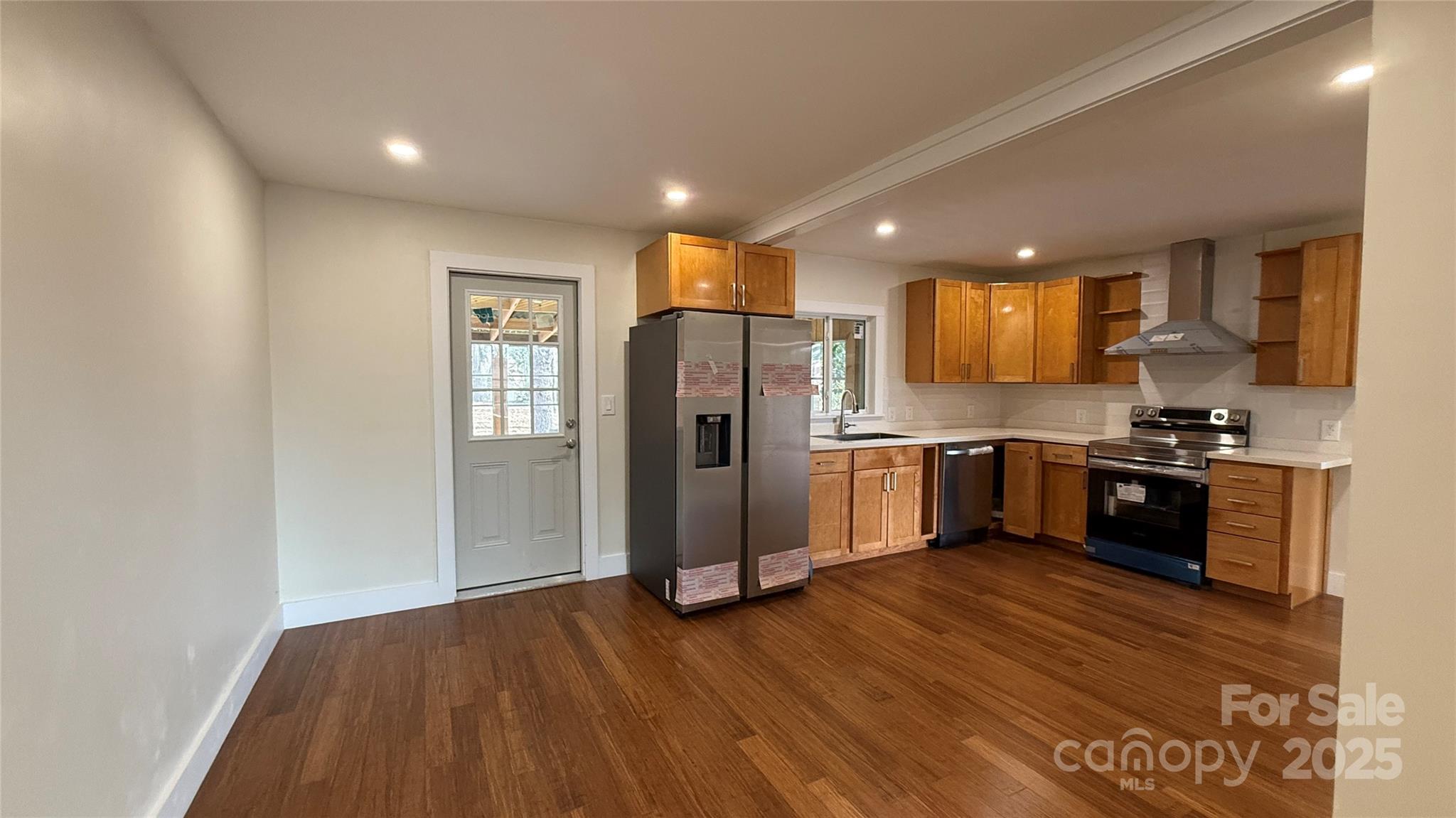 809 Howard Street Shelby, NC 28152 - Photo 28 of 41 a kitchen with a refrigerator and a stove top oven