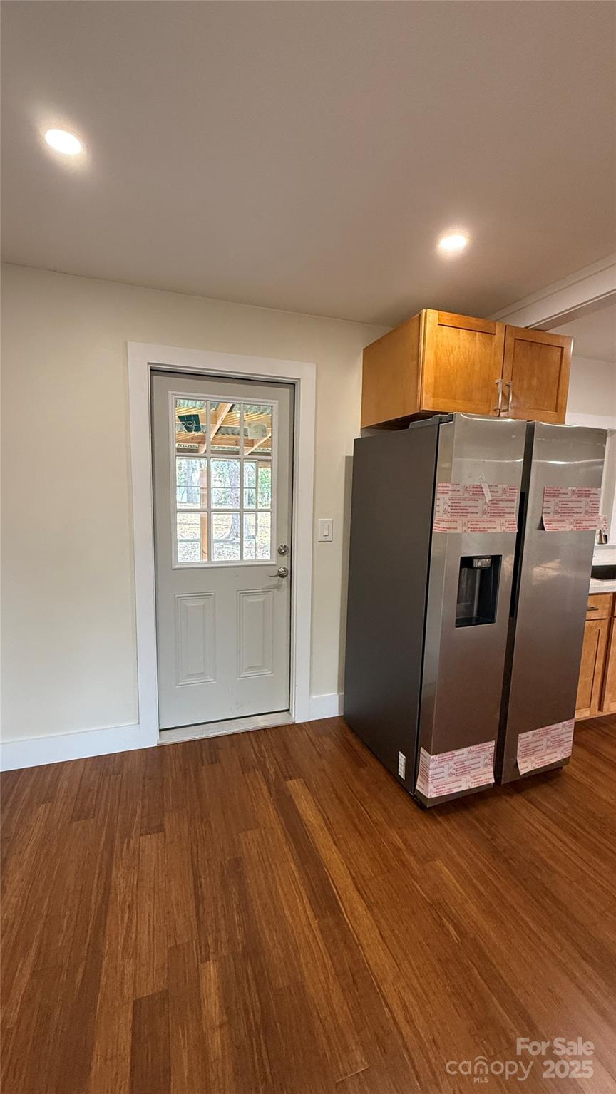 809 Howard Street Shelby, NC 28152 - Photo 39 of 41 a view of an empty room with wooden floor and a window