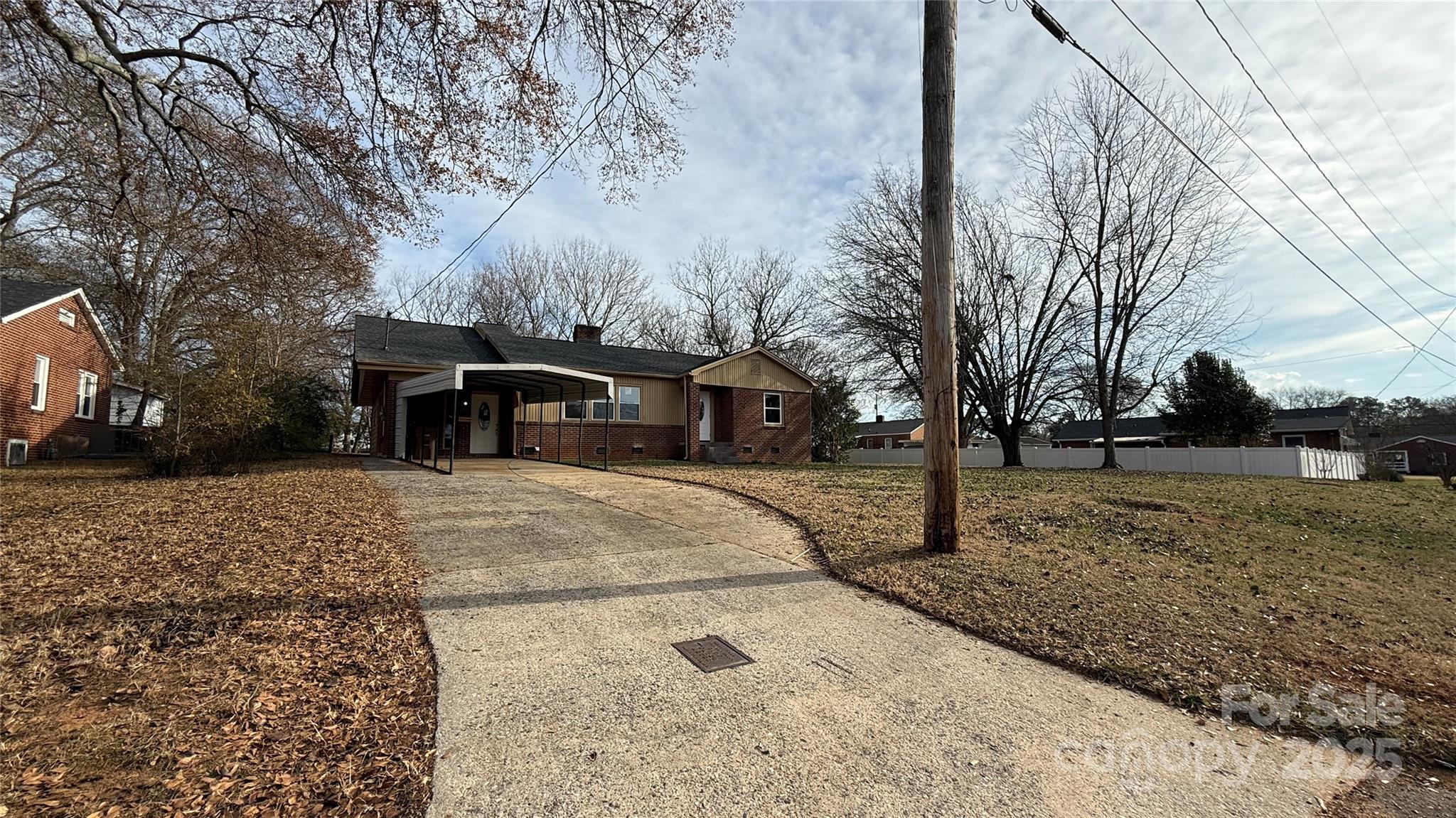 809 Howard Street Shelby, NC 28152 - Photo 4 of 41 a view of a yard with cars on road