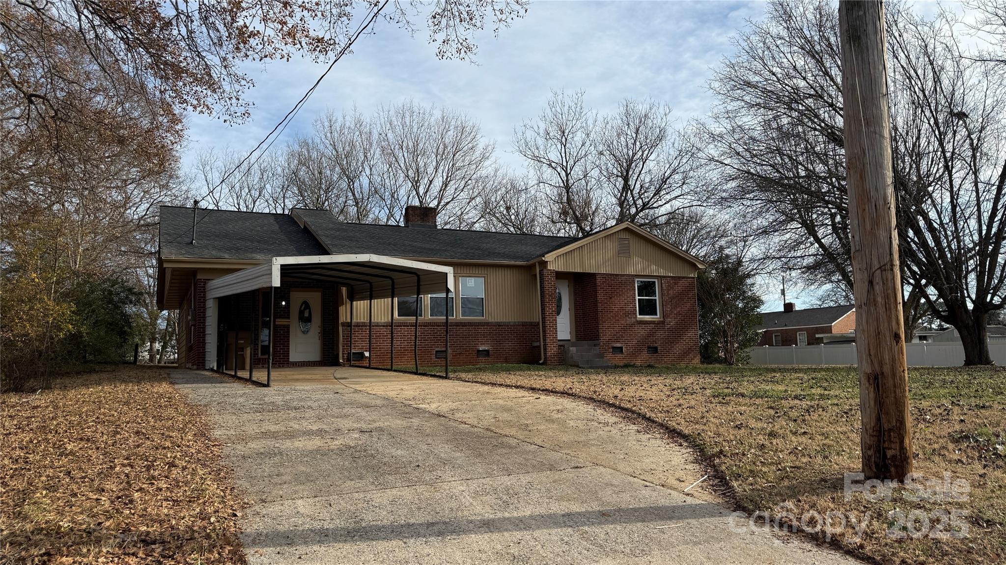 809 Howard Street Shelby, NC 28152 - Photo 5 of 41 a view of a house with a yard covered in snow