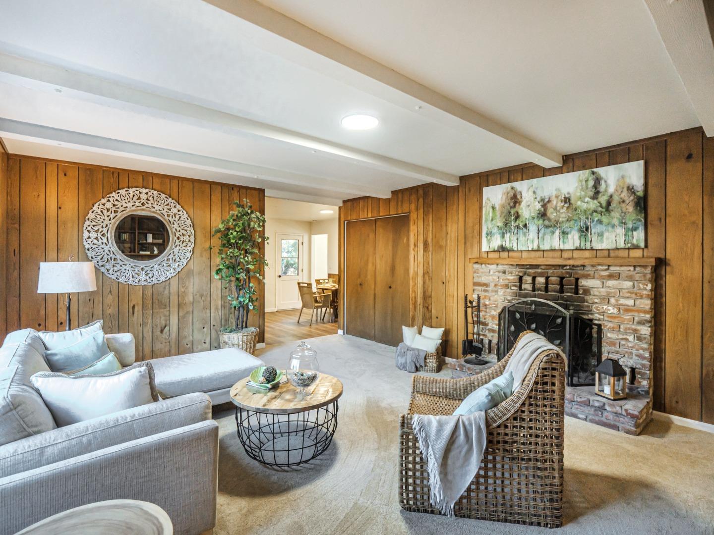 8460 Hihn Road Ben Lomond, CA 95005 - Photo 17 of 50 a living room with furniture a fireplace and a large window