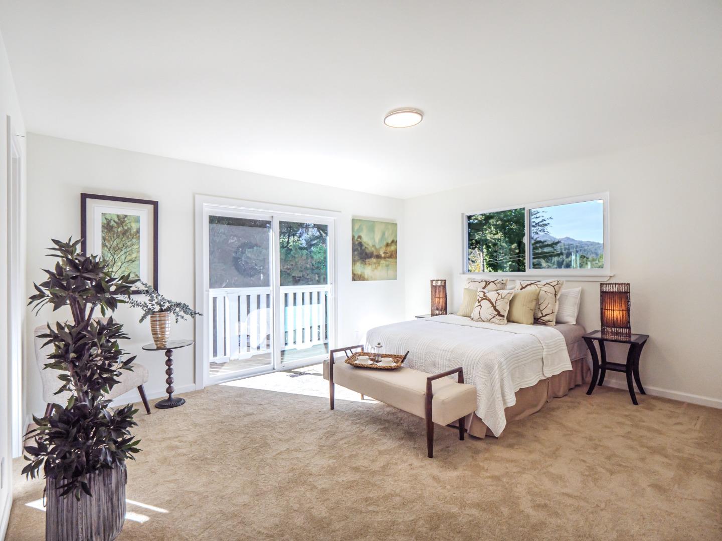 8460 Hihn Road Ben Lomond, CA 95005 - Photo 22 of 50 a spacious bedroom with a bed and a window