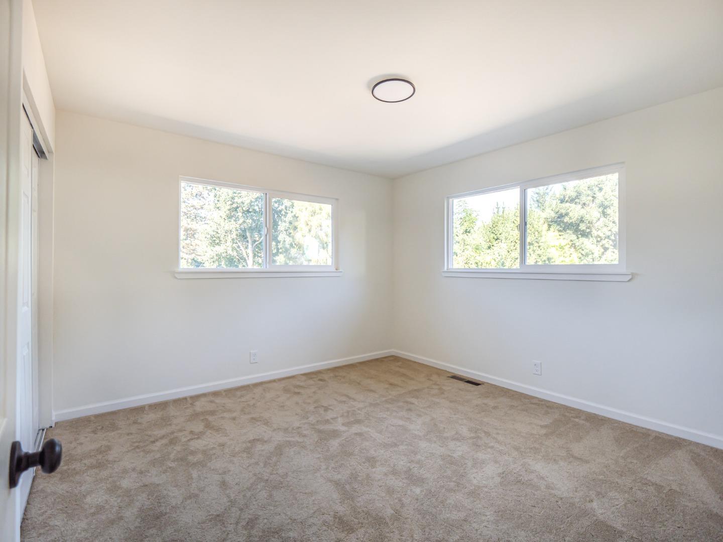 8460 Hihn Road Ben Lomond, CA 95005 - Photo 29 of 50 an empty room with windows