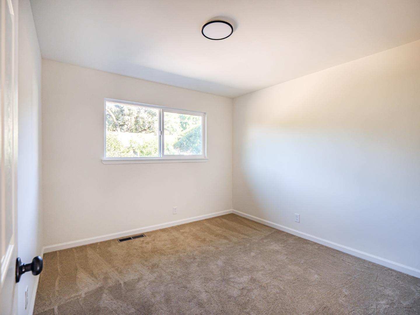 8460 Hihn Road Ben Lomond, CA 95005 - Photo 33 of 50 an empty room with a window
