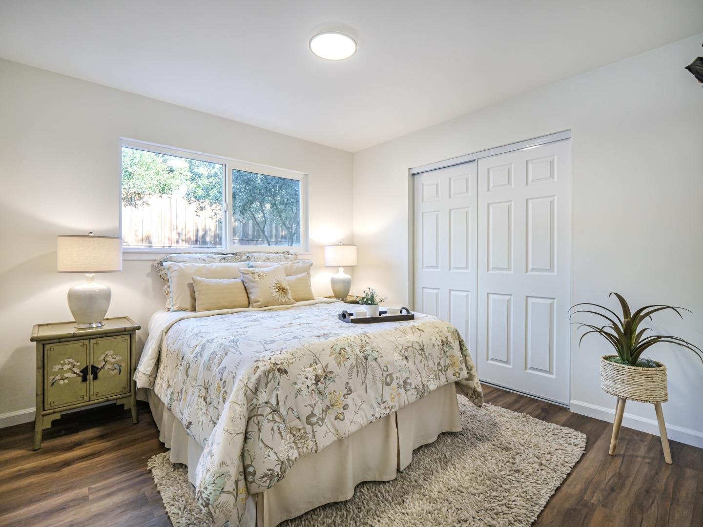 8460 Hihn Road Ben Lomond, CA 95005 - Photo 37 of 50 a bedroom with a bed and a window