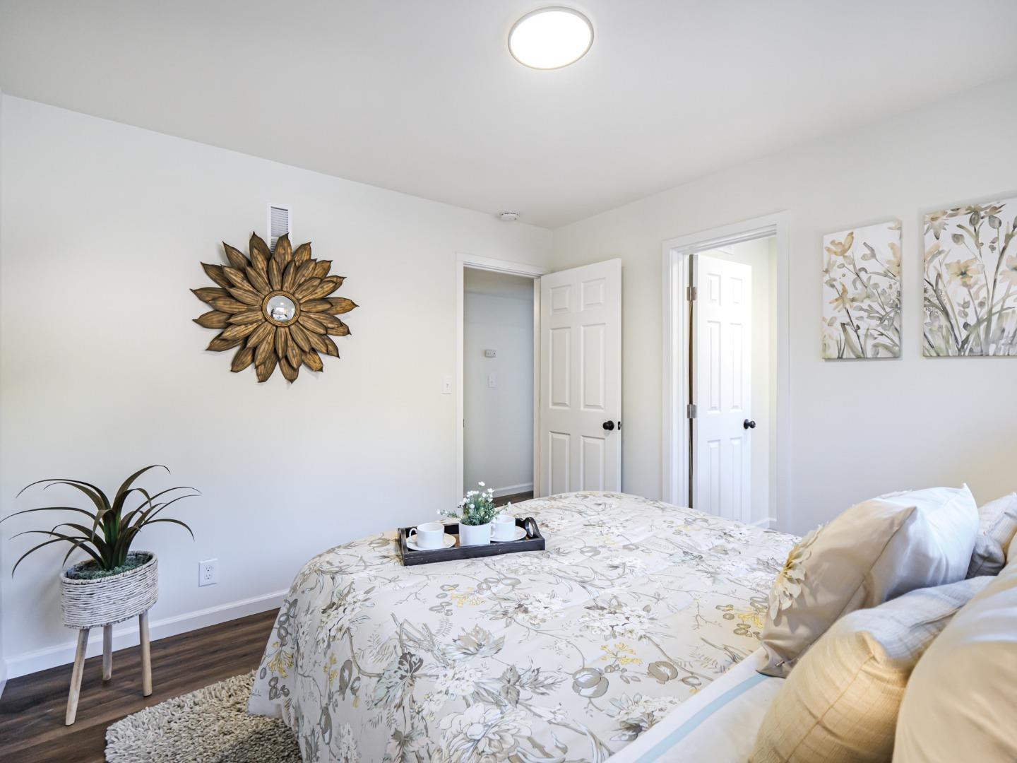 8460 Hihn Road Ben Lomond, CA 95005 - Photo 38 of 50 a bedroom with a bed and a potted plant