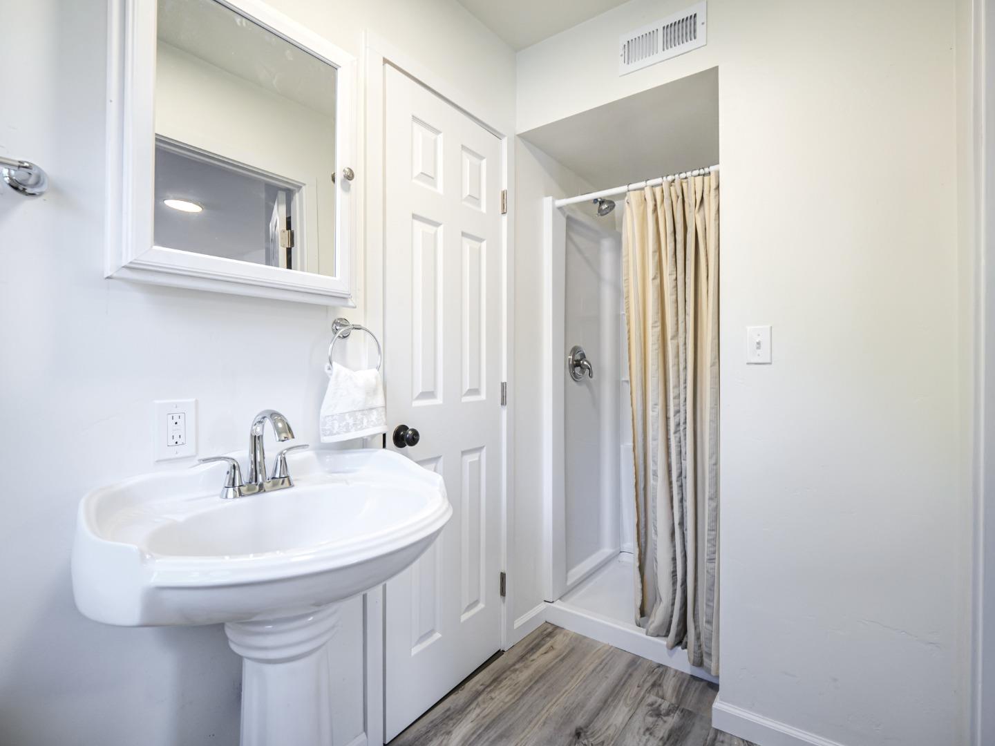 8460 Hihn Road Ben Lomond, CA 95005 - Photo 40 of 50 a bathroom with a sink a mirror and a toilet