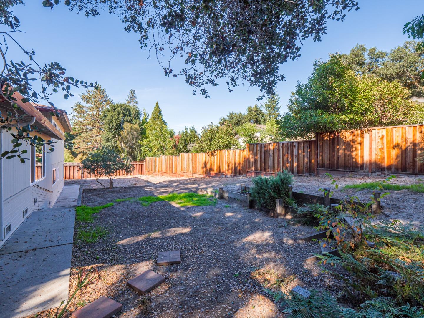 8460 Hihn Road Ben Lomond, CA 95005 - Photo 44 of 50 a view of a backyard with large tree and wooden fence