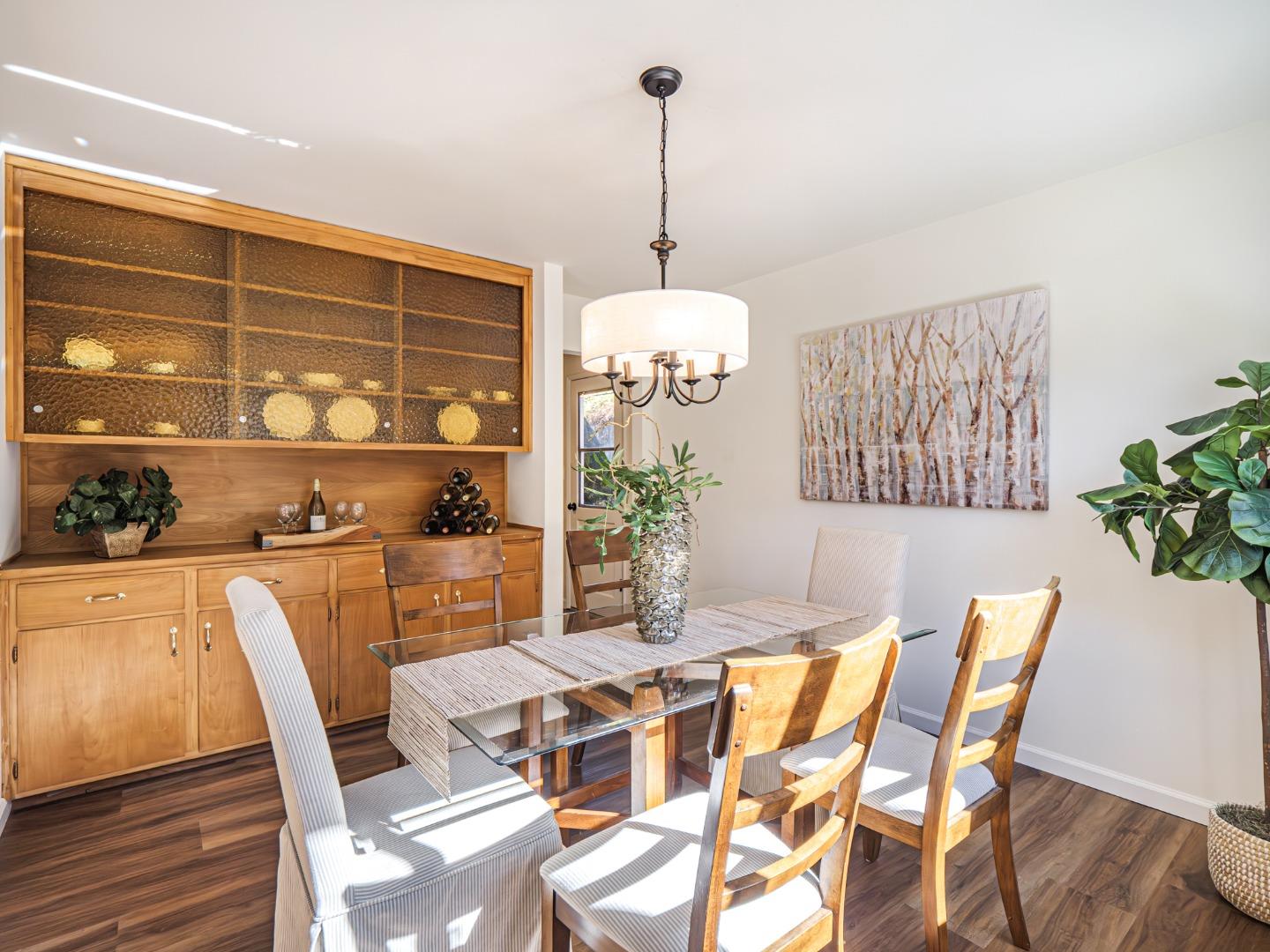 8460 Hihn Road Ben Lomond, CA 95005 - Photo 9 of 50 a dining room with furniture a chandelier and wooden floor
