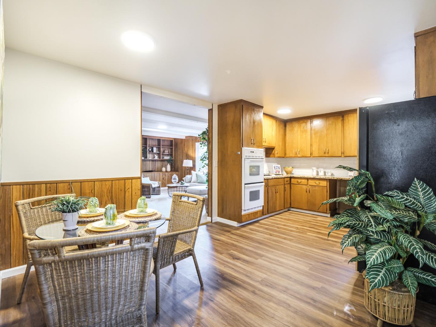 8460 Hihn Road Ben Lomond, CA 95005 - Photo 10 of 50 a kitchen with a table chairs refrigerator and cabinets