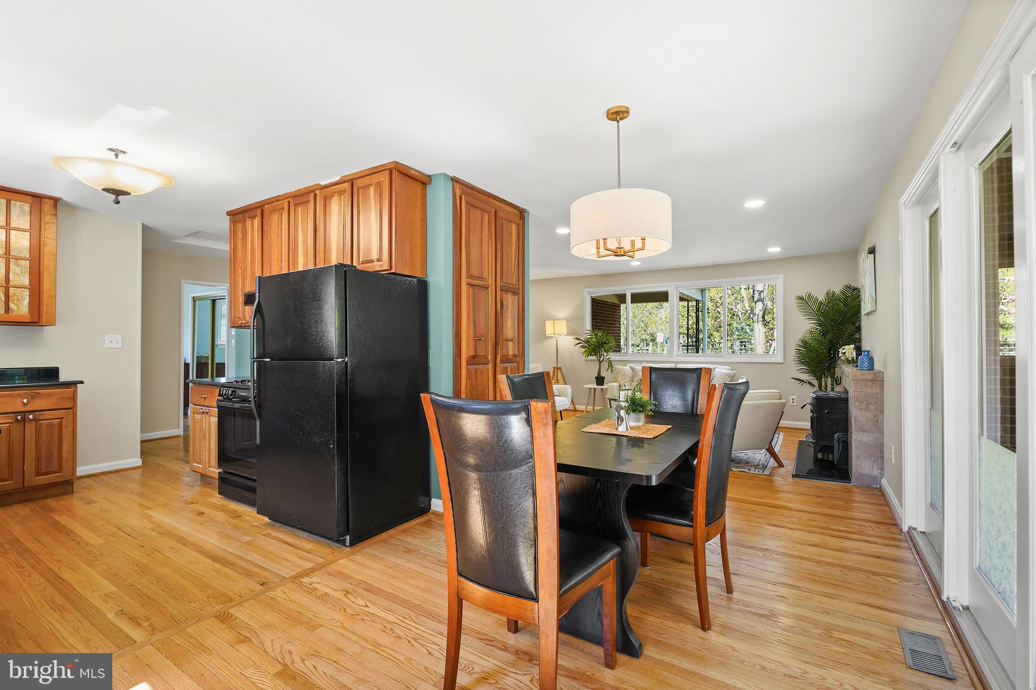8600 Grubb Road Chevy Chase, MD 20815 - Photo 12 of 36 a view of a dining room with furniture window and wooden floor
