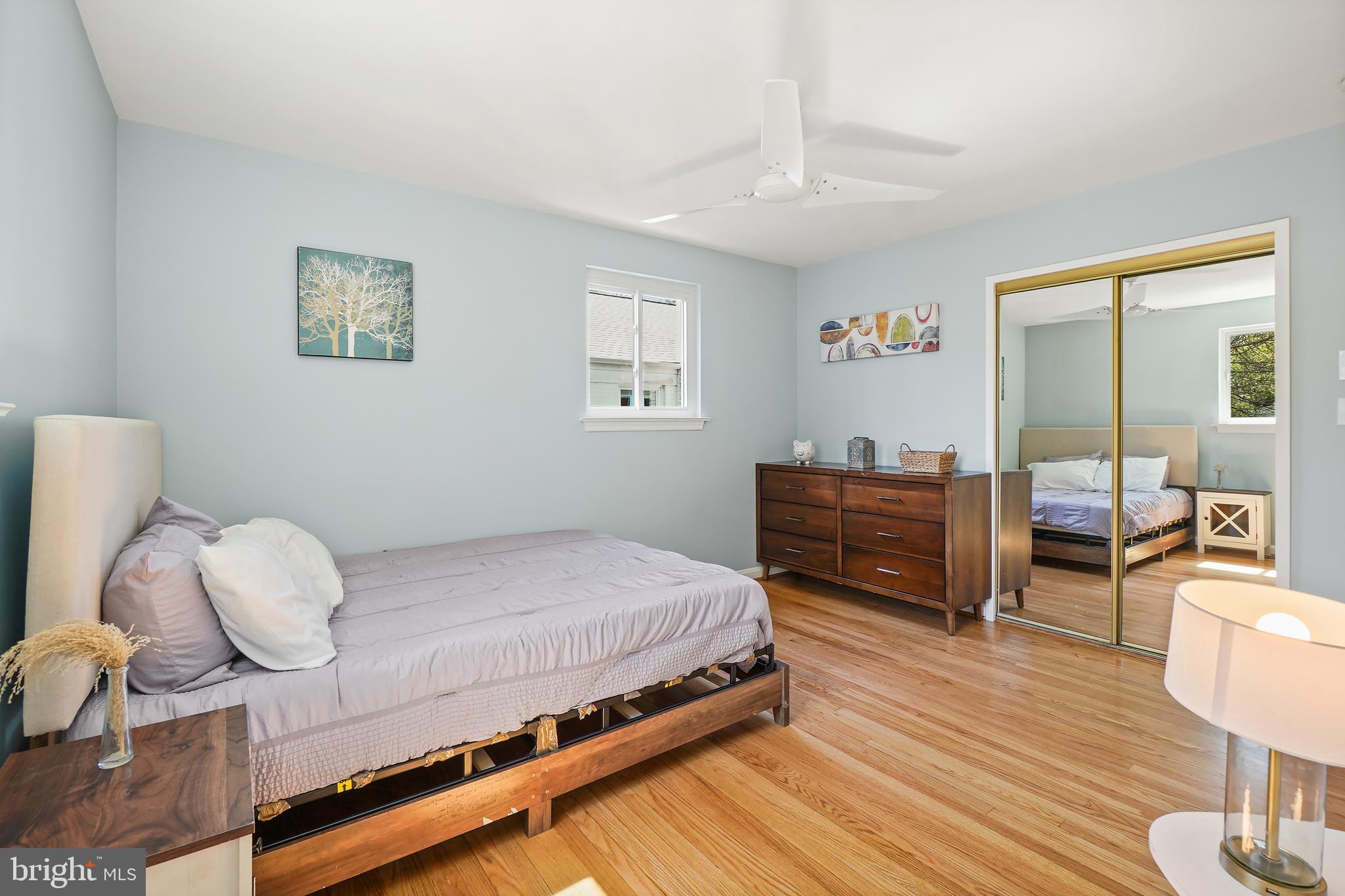 8600 Grubb Road Chevy Chase, MD 20815 - Photo 17 of 36 a bedroom with a bed and wooden floor