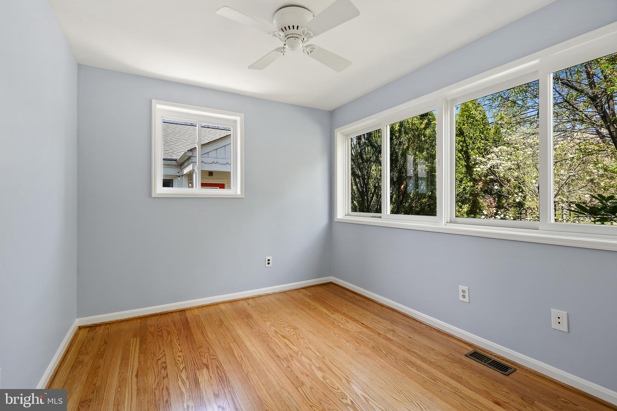8600 Grubb Road Chevy Chase, MD 20815 - Photo 19 of 36 a view of empty room with wooden floor and fan