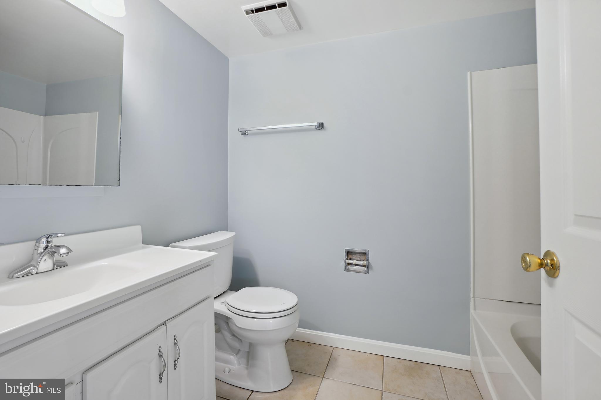 8600 Grubb Road Chevy Chase, MD 20815 - Photo 27 of 36 a bathroom with a sink toilet and vanity