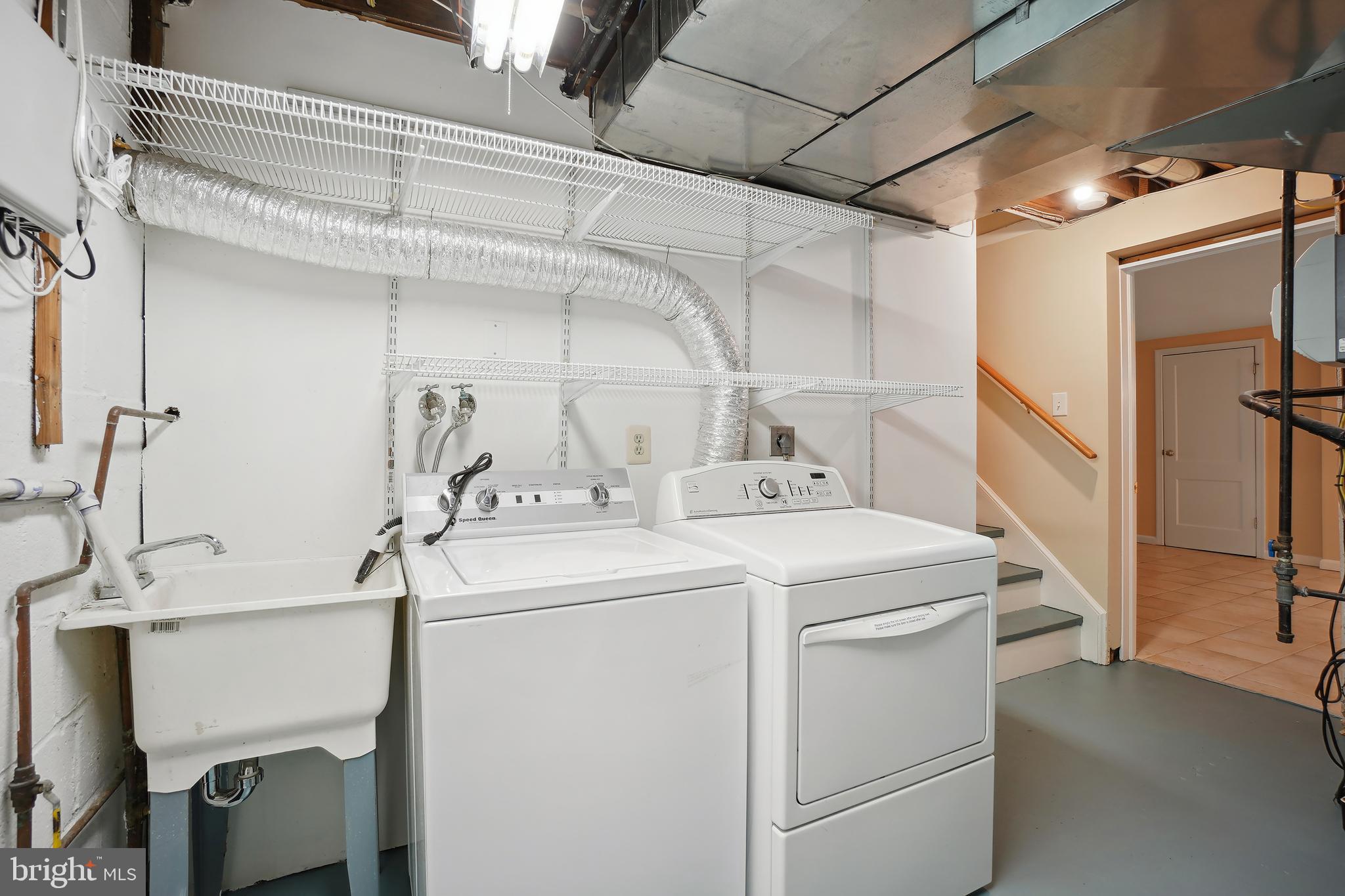 8600 Grubb Road Chevy Chase, MD 20815 - Photo 28 of 36 a utility room with dryer and washer