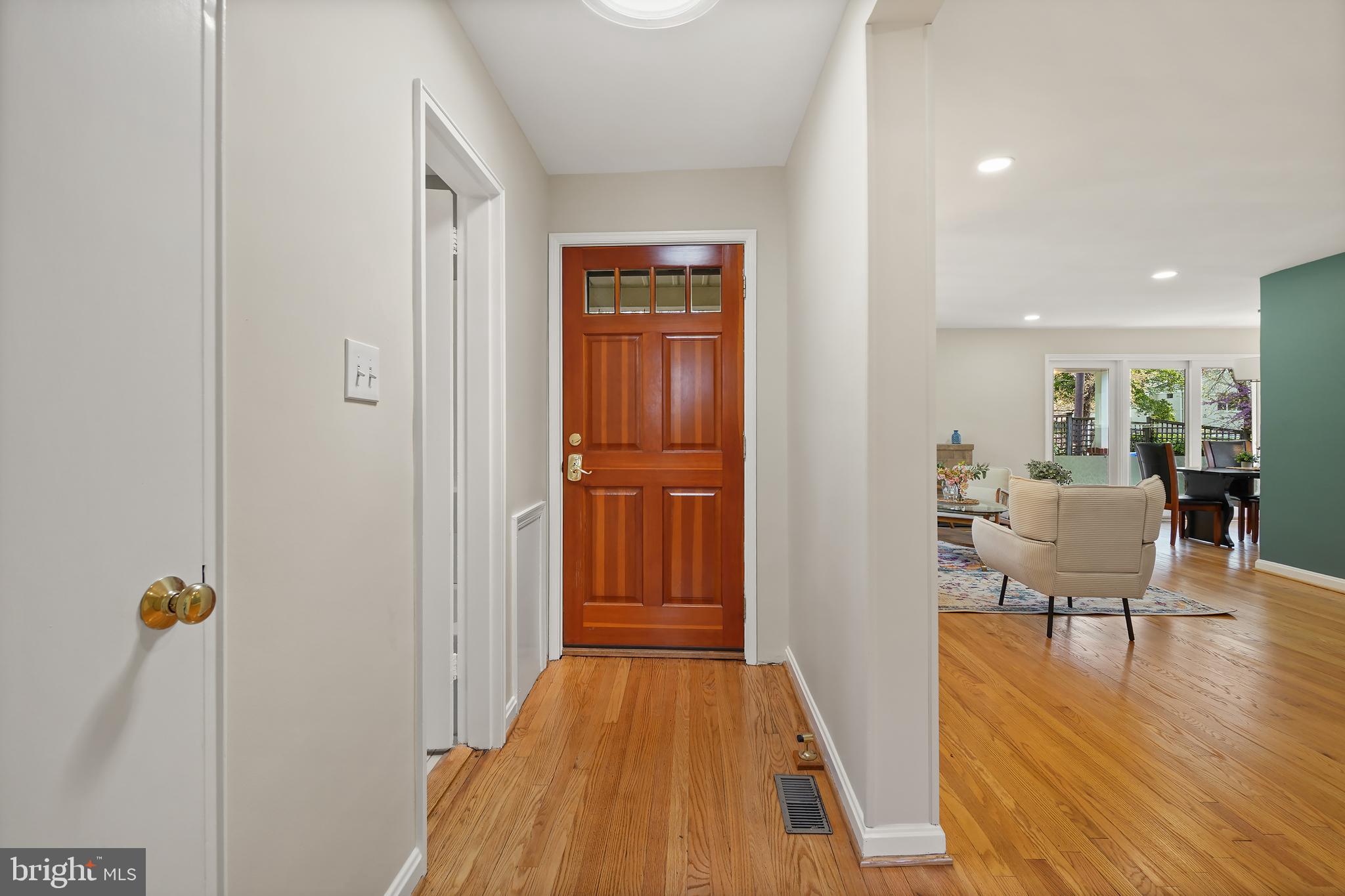 8600 Grubb Road Chevy Chase, MD 20815 - Photo 3 of 36 a view of a livingroom with wooden floor and furniture