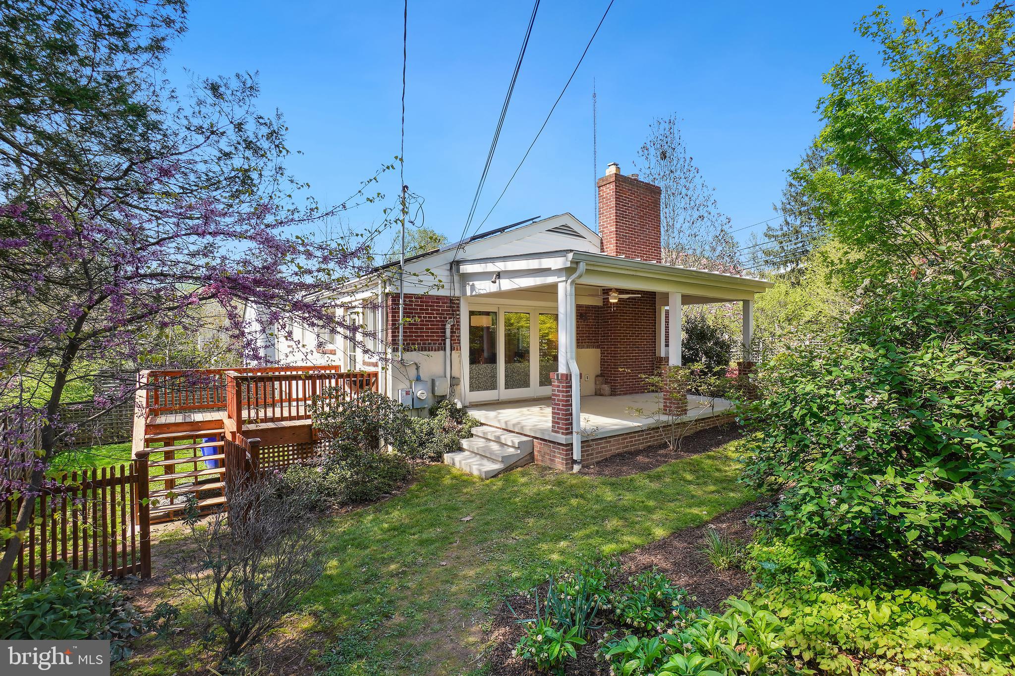 8600 Grubb Road Chevy Chase, MD 20815 - Photo 32 of 36 a front view of a house with garden