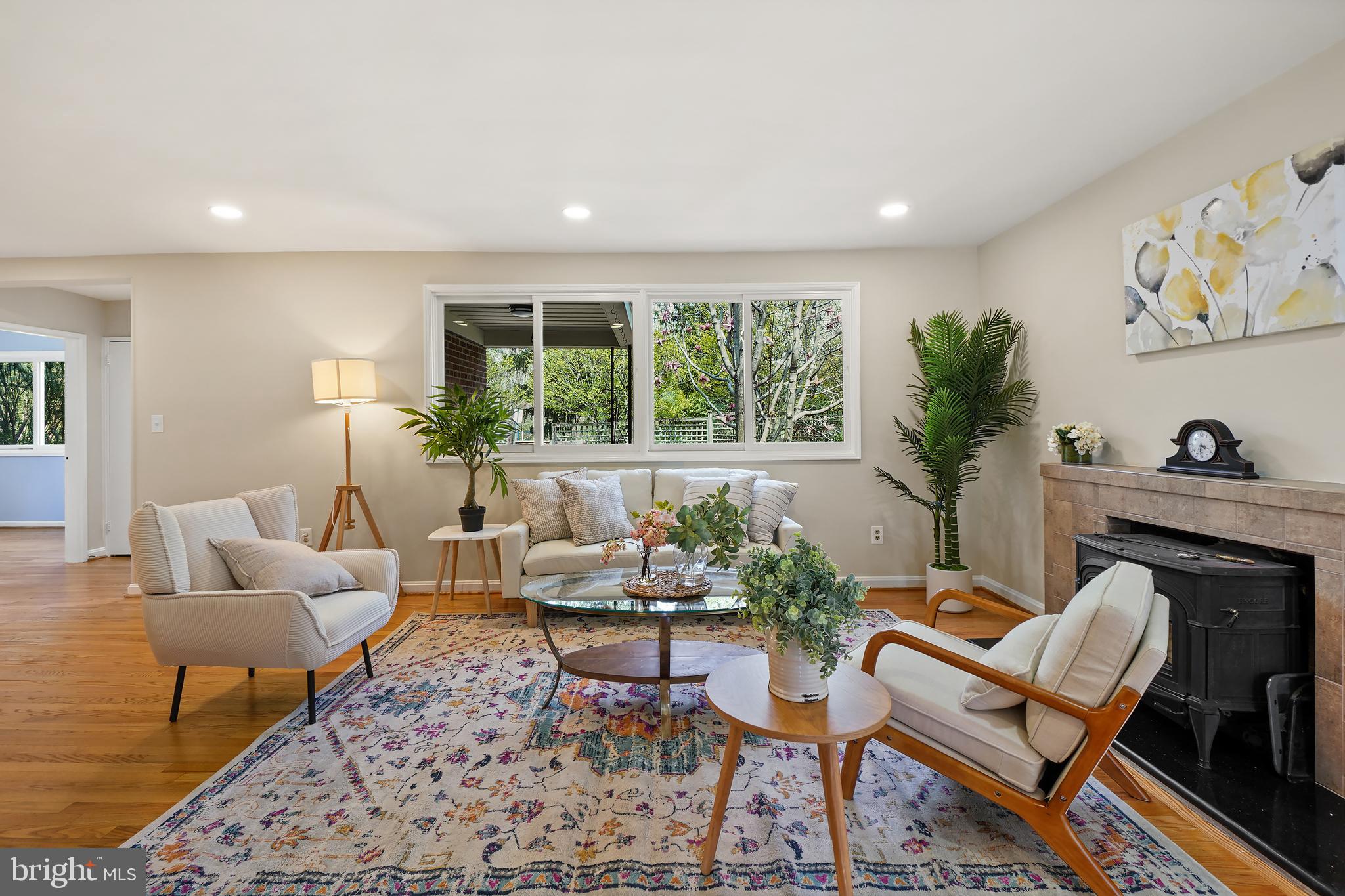 8600 Grubb Road Chevy Chase, MD 20815 - Photo 4 of 36 a living room with furniture a rug and a fireplace