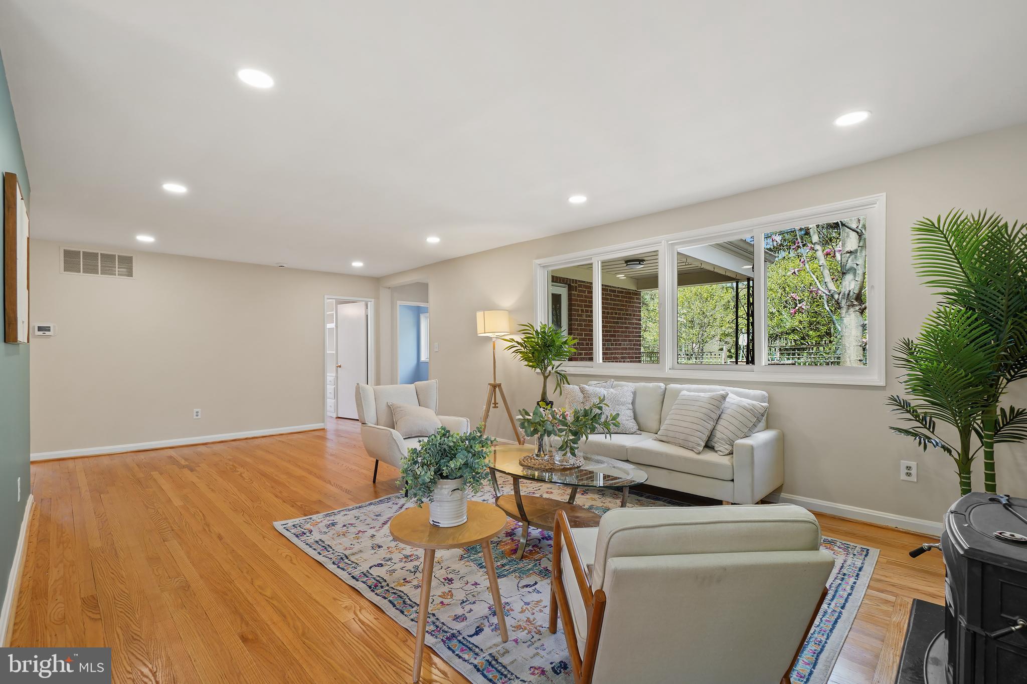 8600 Grubb Road Chevy Chase, MD 20815 - Photo 6 of 36 a living room with furniture and a potted plant