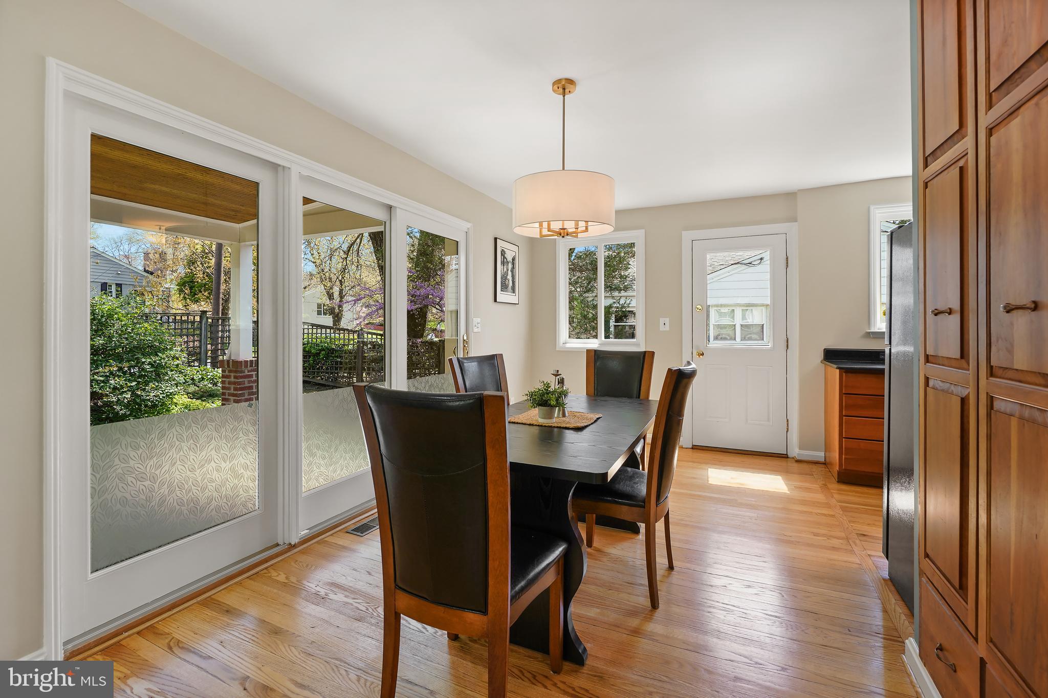 8600 Grubb Road Chevy Chase, MD 20815 - Photo 9 of 36 a view of a dining room with furniture window and wooden floor