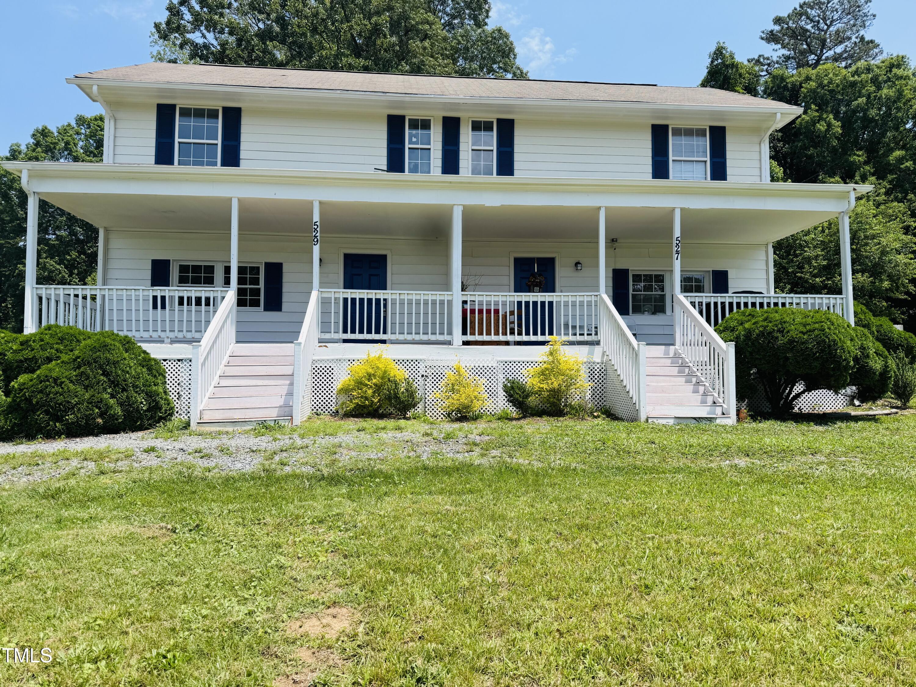 front view of a house with a yard