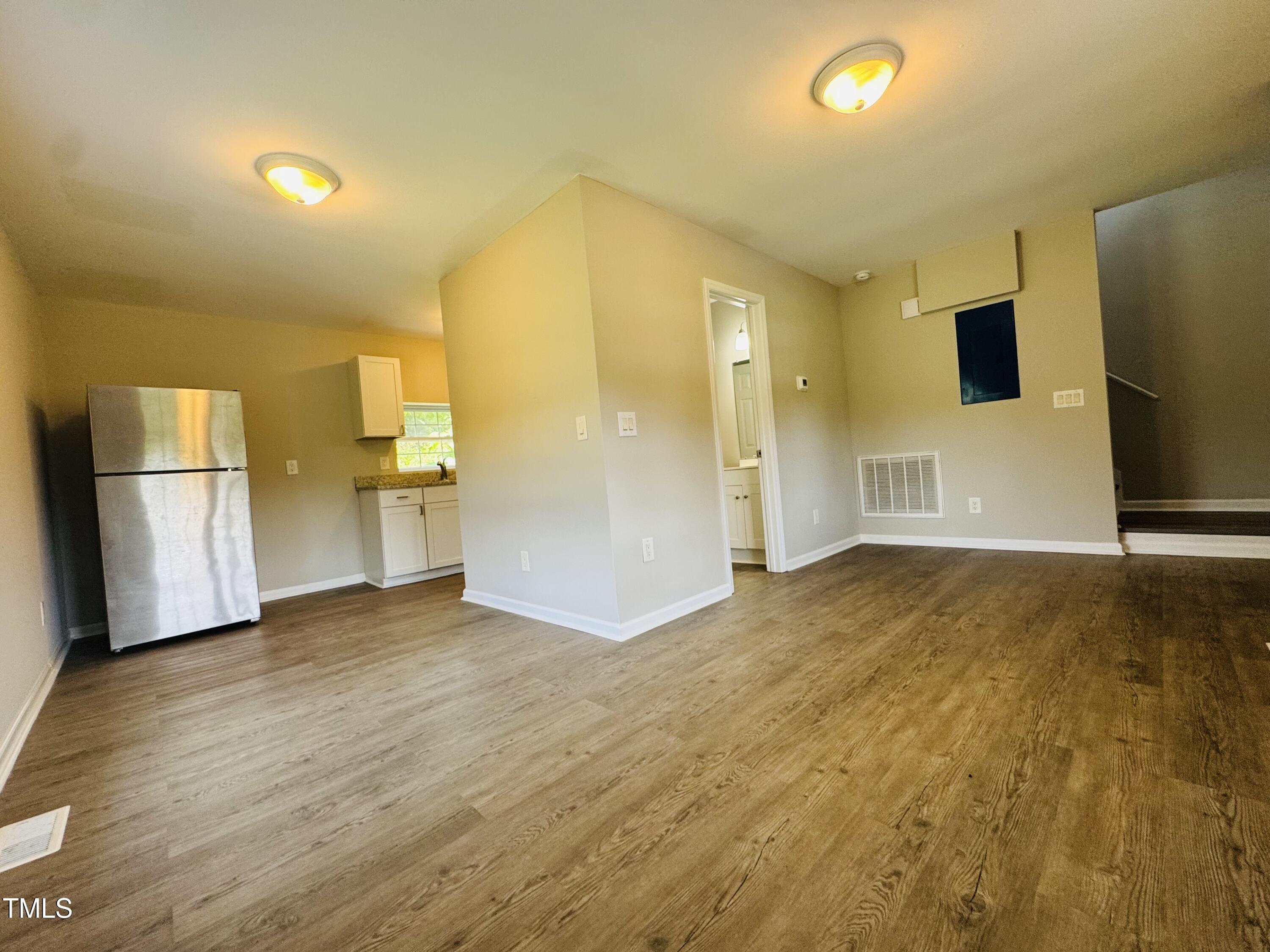 527 Forrest Street Hillsborough, NC 27278 - Photo 7 of 44 a view of empty room with wooden floor
