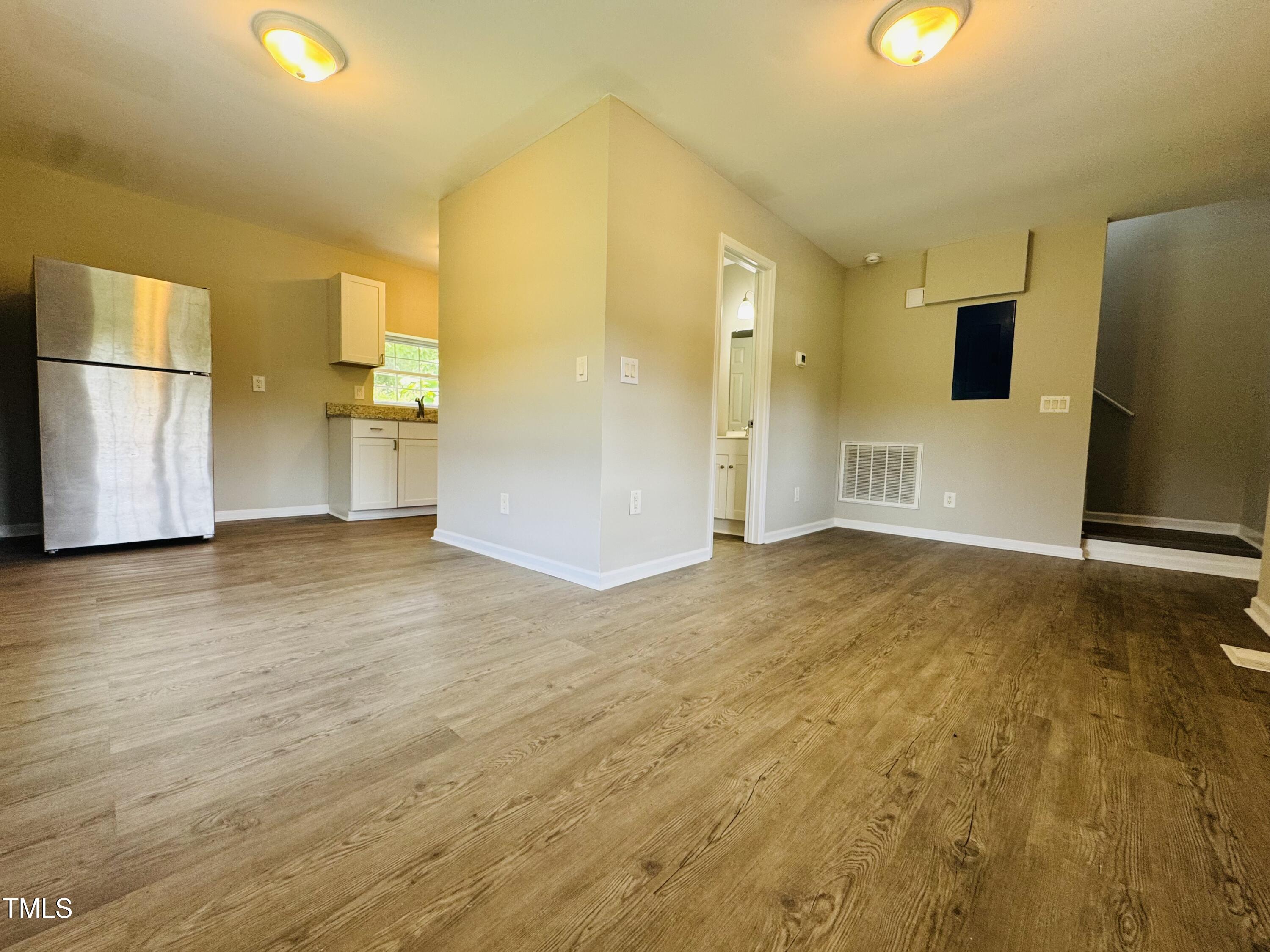 527 Forrest Street Hillsborough, NC 27278 - Photo 12 of 44 a view of empty room with wooden floor