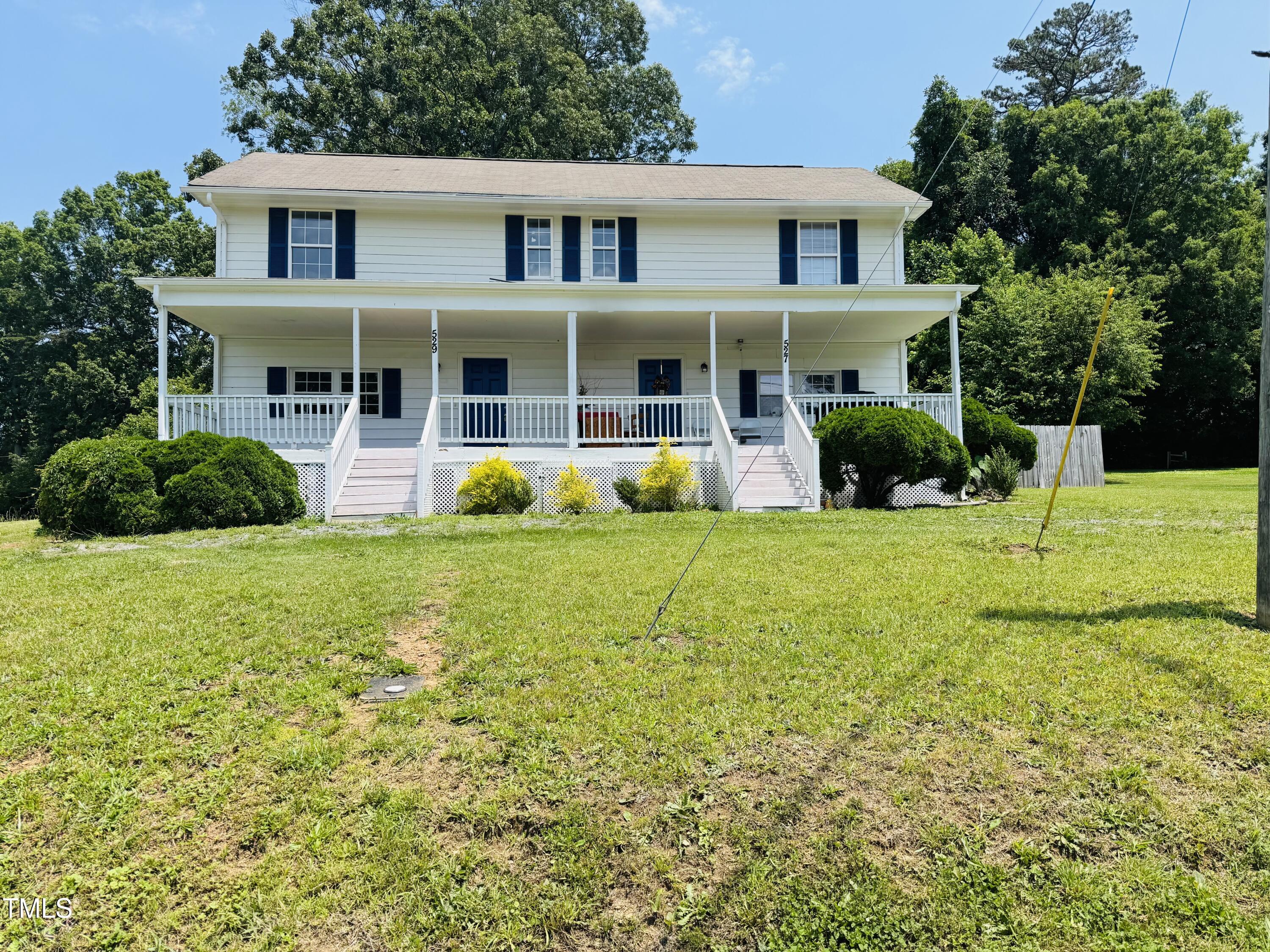 527 Forrest Street Hillsborough, NC 27278 - Photo 2 of 44 a front view of a house with garden