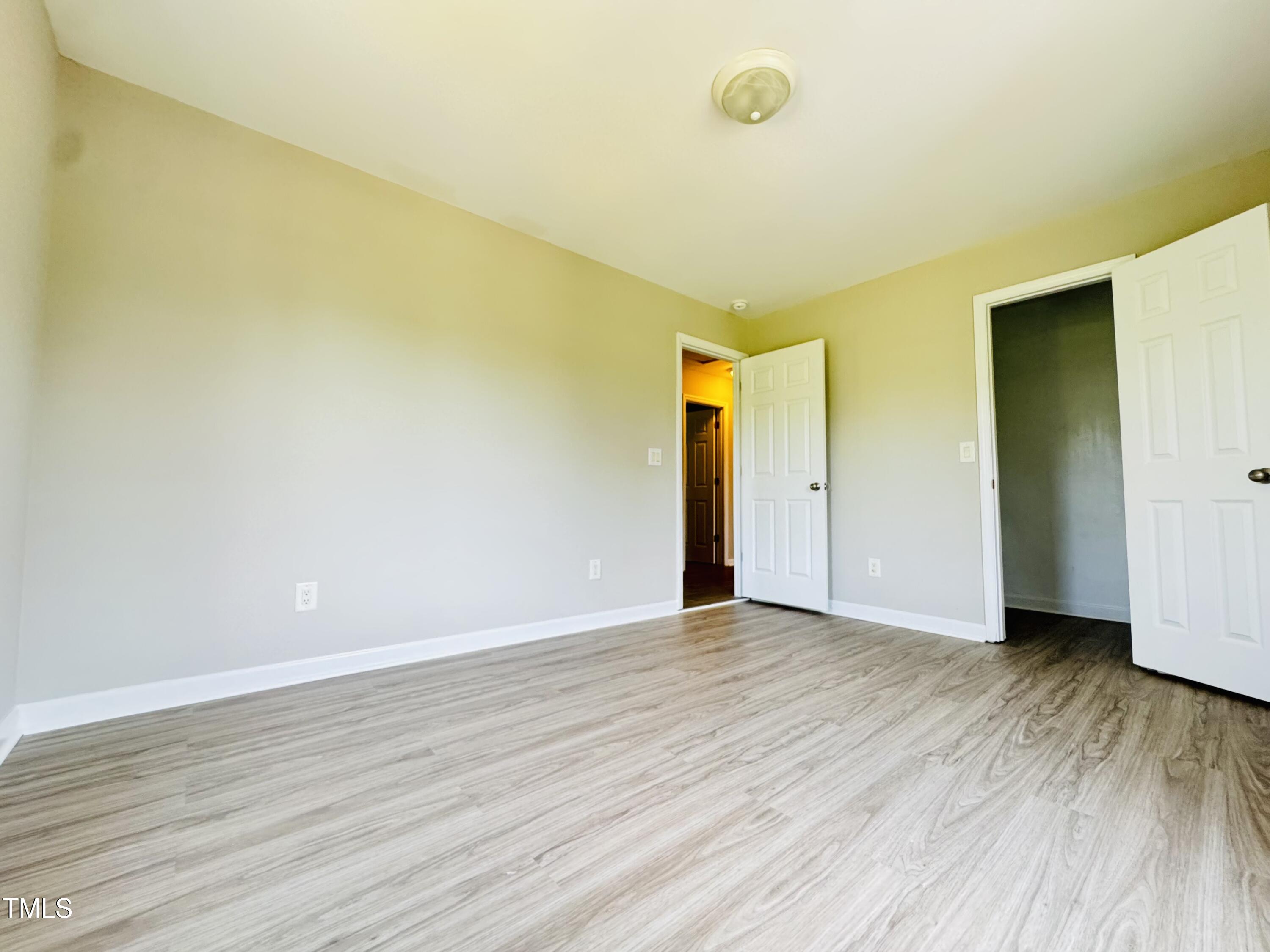 527 Forrest Street Hillsborough, NC 27278 - Photo 24 of 44 a view of an empty room with wooden floor