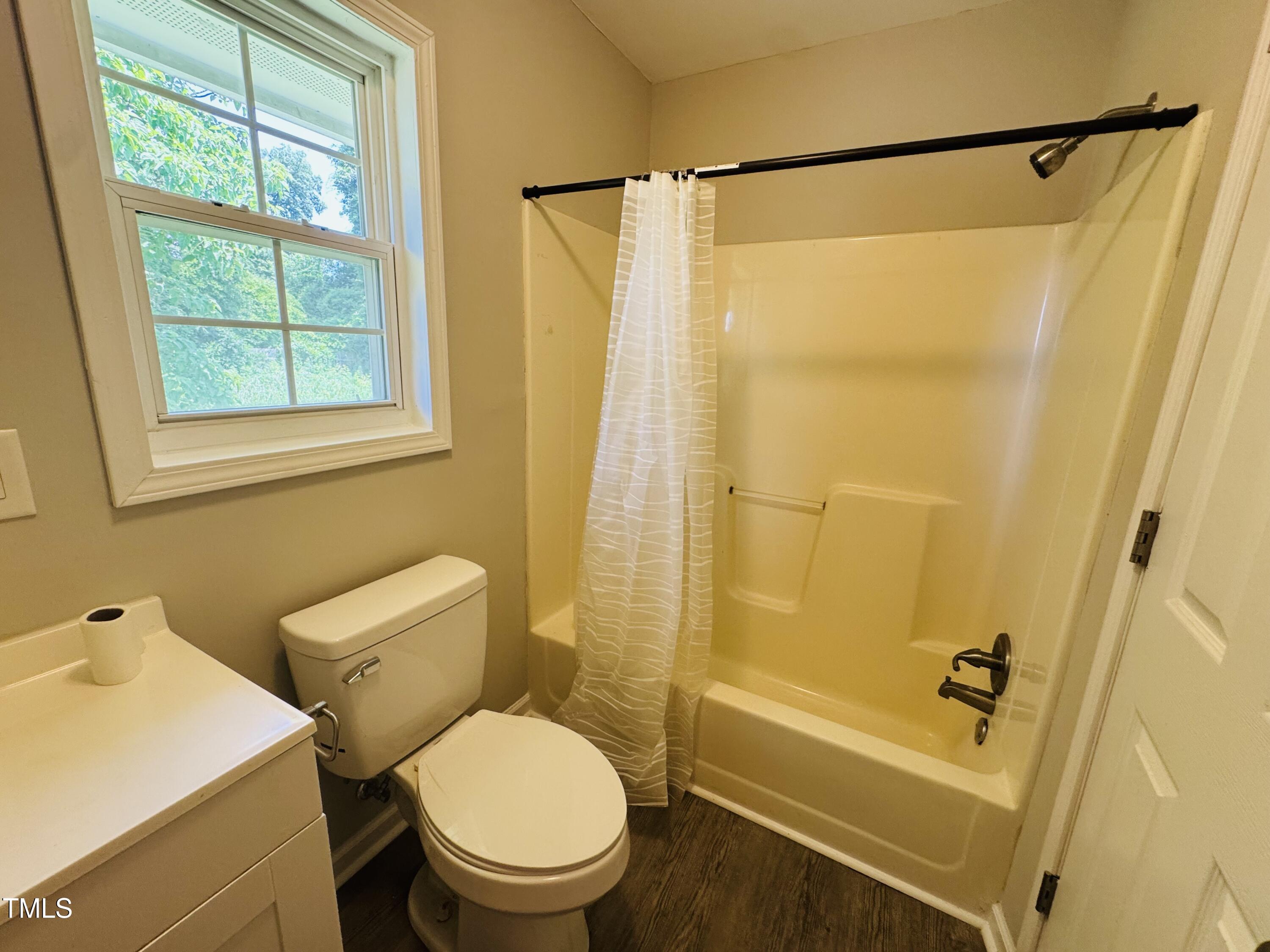 527 Forrest Street Hillsborough, NC 27278 - Photo 30 of 44 a white toilet sitting next to a bath tub shower