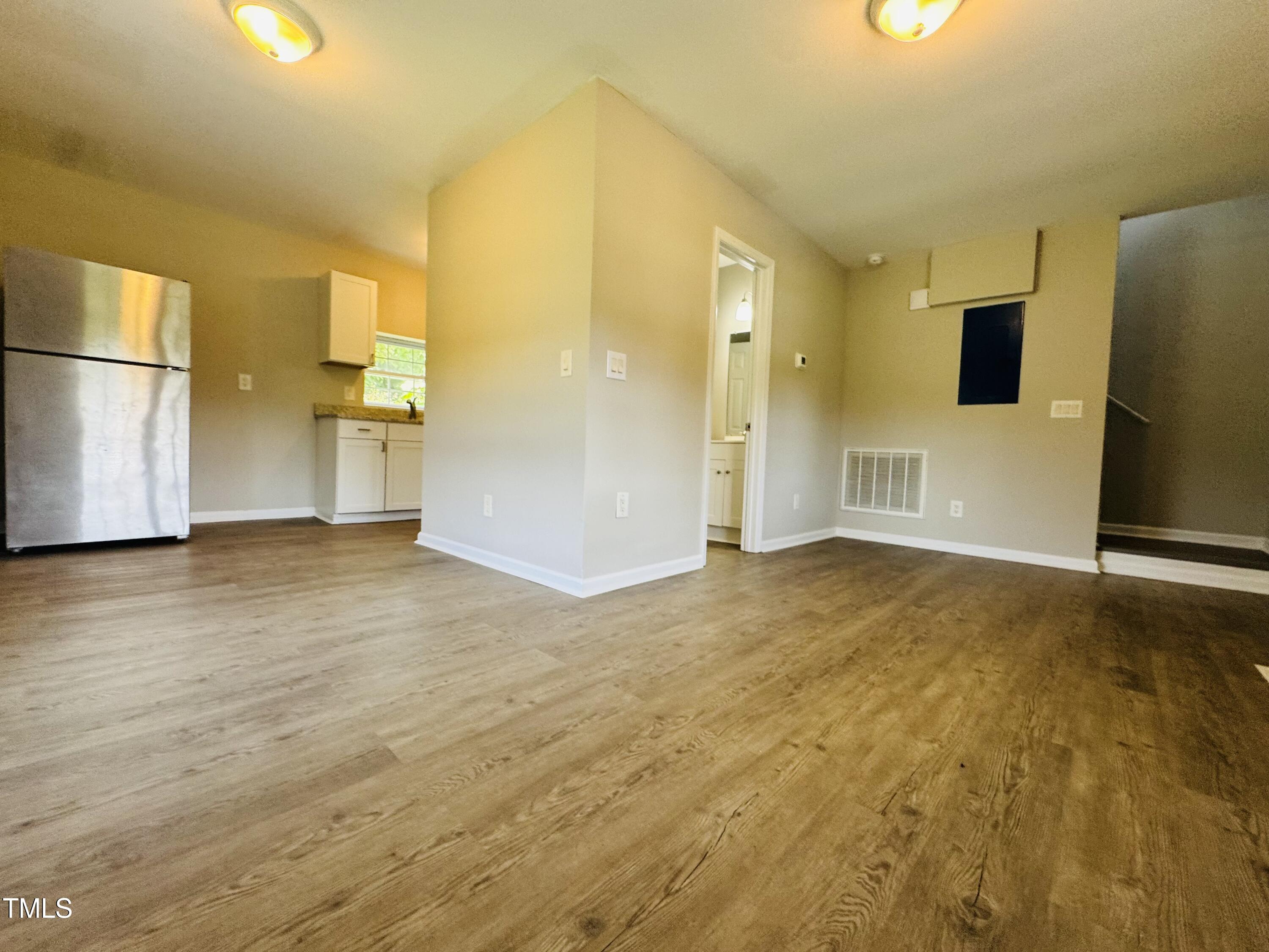 527 Forrest Street Hillsborough, NC 27278 - Photo 3 of 44 a view of empty room with wooden floor