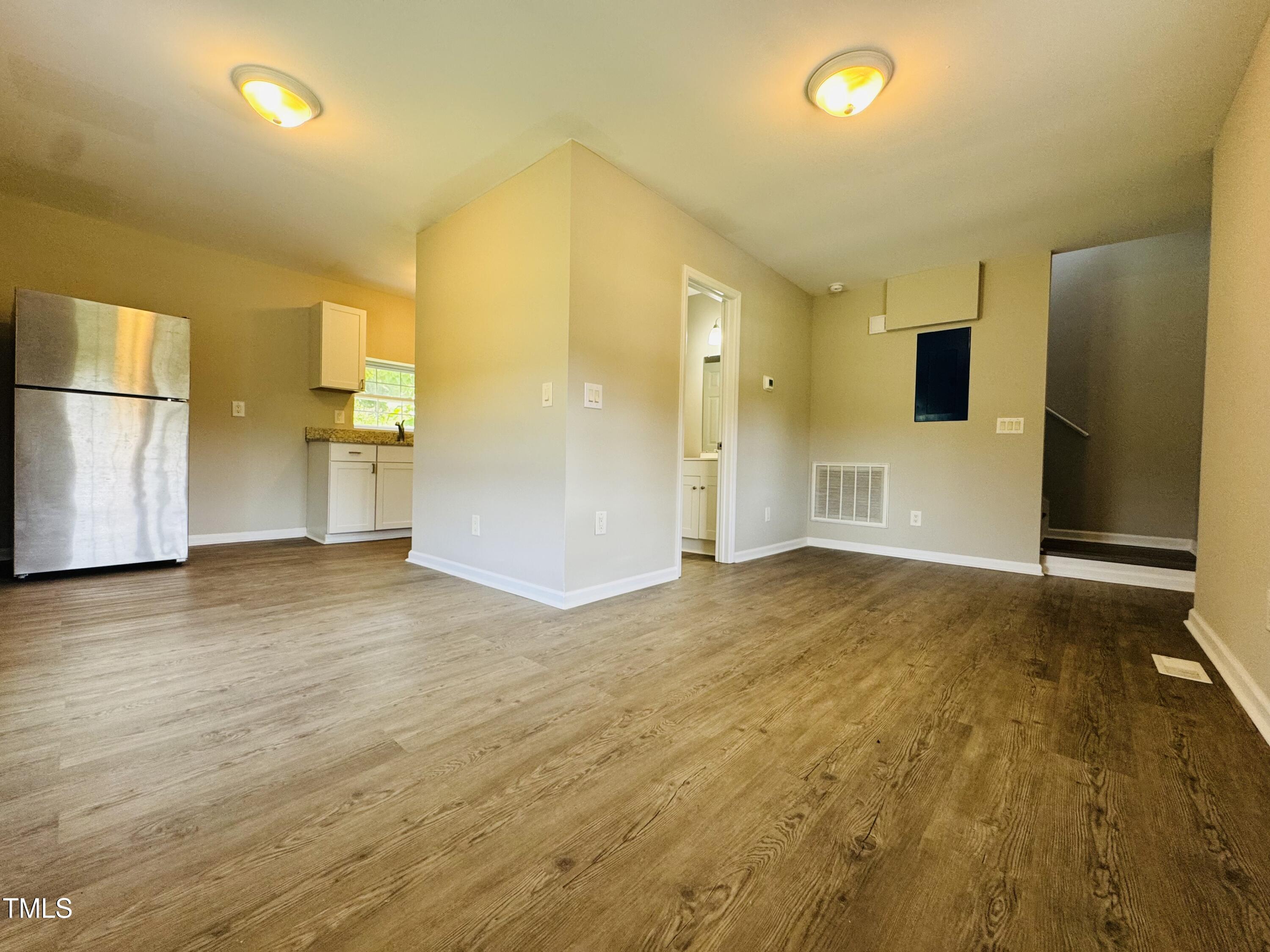 527 Forrest Street Hillsborough, NC 27278 - Photo 4 of 44 a view of empty room with wooden floor