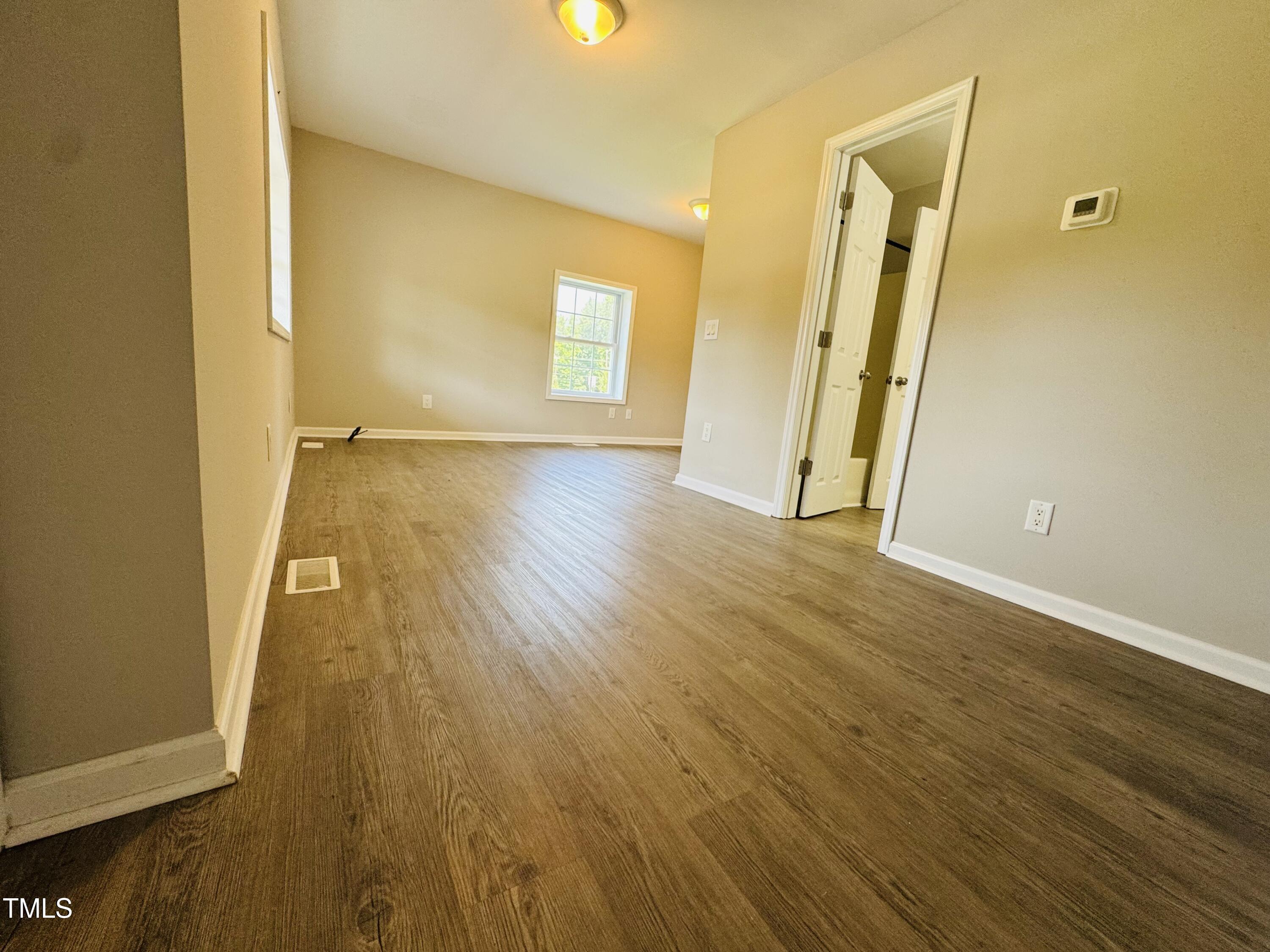 527 Forrest Street Hillsborough, NC 27278 - Photo 5 of 44 a view of a hallway with wooden floor
