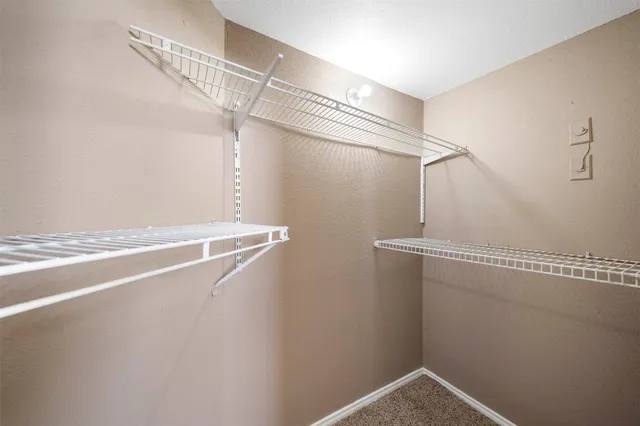 a view of a room with racks on the wall