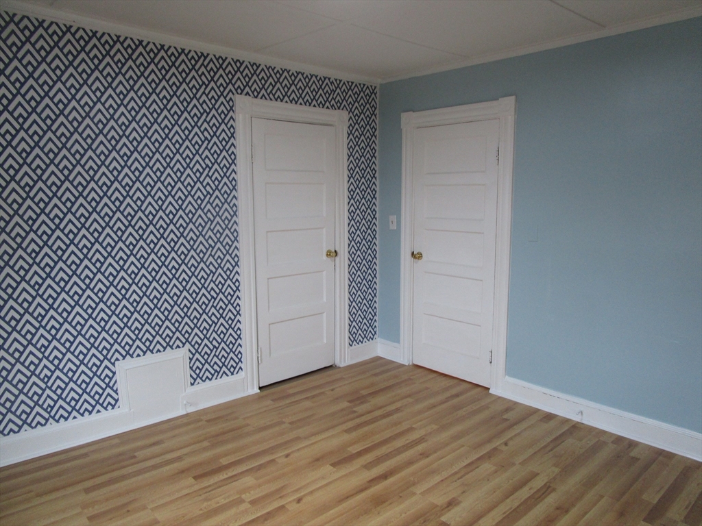 226 Irving Street, Unit 2 Framingham, MA 01702 - Photo 7 of 10 a view of a black gate