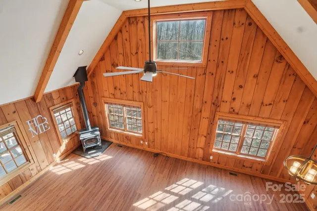 a view of front door with furniture and a window