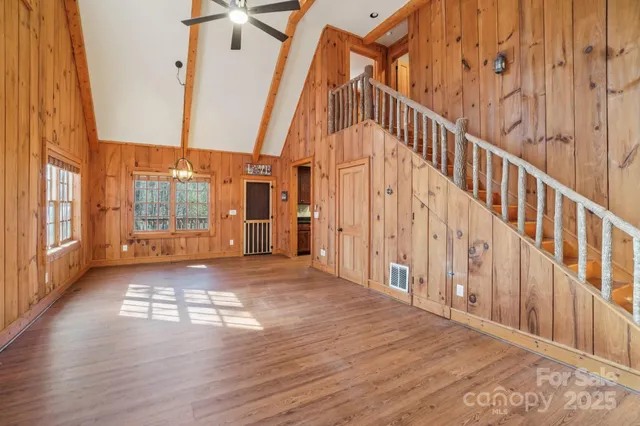 a view of an entryway with wooden floor