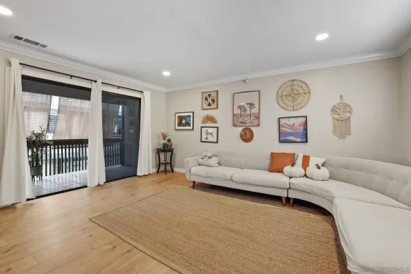 a living room with furniture and large window